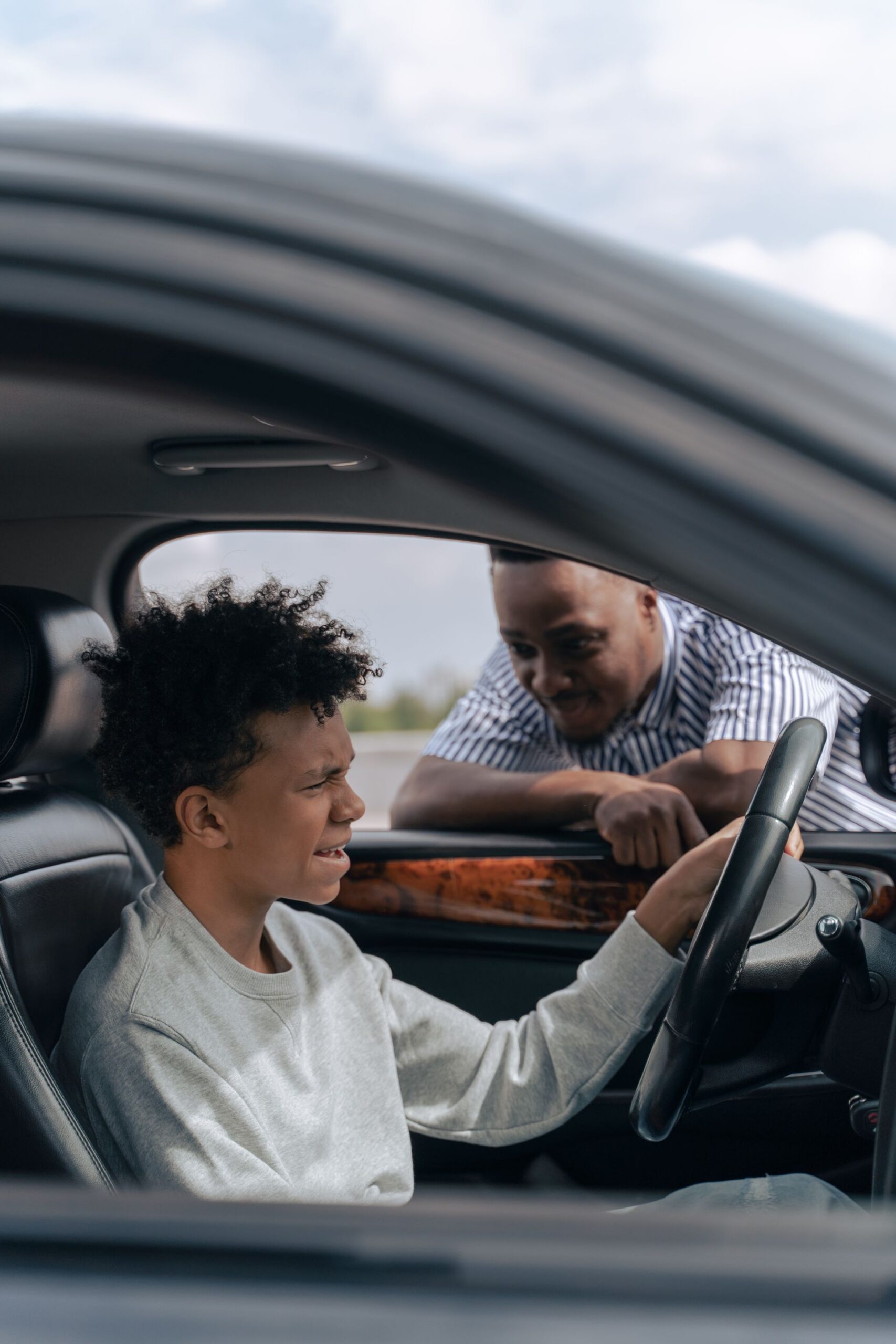 Driving instructor and student in car